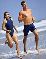 couple running on beach